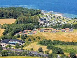 An aerial view of a coastal vacation rental community with multiple houses and a marina. - 5 Person Holiday Home on a Holiday Park in Aabenraa (Aabenraa)