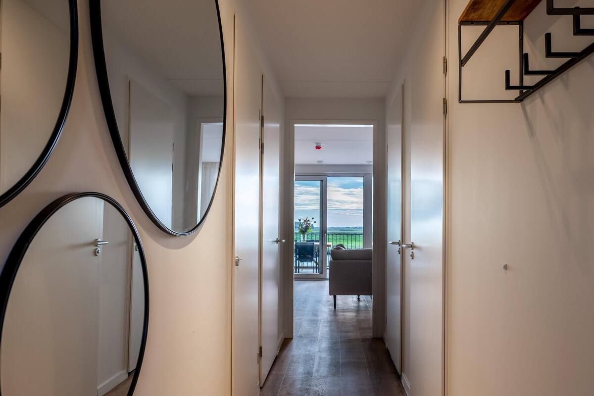 A hallway with a view to a balcony.