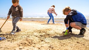 A sandy beach with people engaging in activities. - 8 Person Holiday Home on a Holiday Park in Blavand (Blavand)