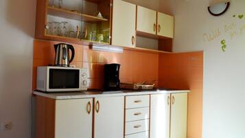 Classic Apartment, 2 Bedrooms | Private kitchen | Fridge, microwave, coffee/tea maker, electric kettle