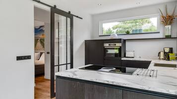 Deluxe House, 3 Bedrooms | Private kitchen | Fridge, microwave, dishwasher, coffee/tea maker