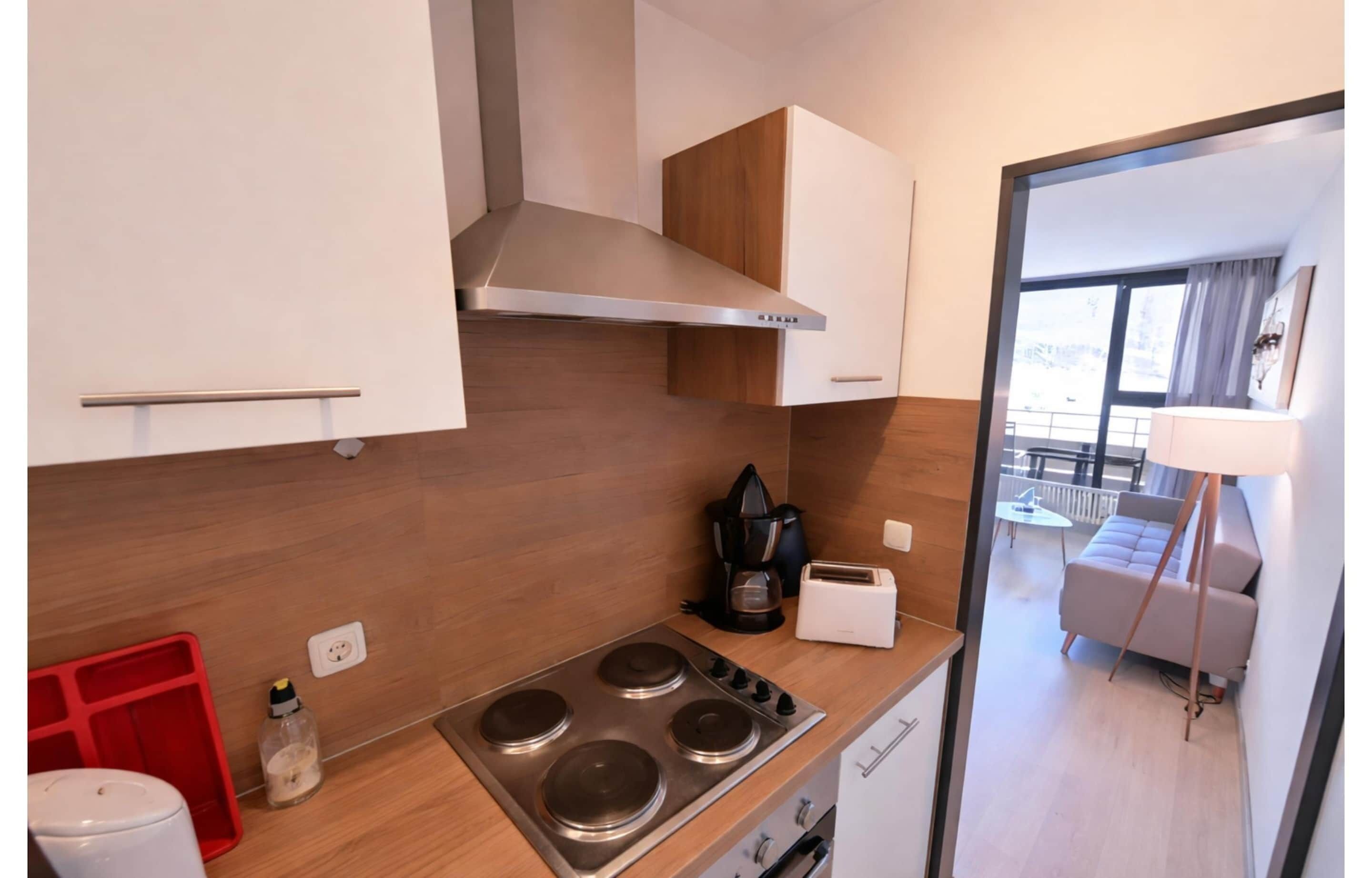 Departamento Confort, 1 habitación | Cocina privada | Refrigerador, microondas, lavavajillas y cafetera y tetera 