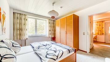 Deluxe Apartment, 1 Bedroom | 4 bedrooms, individually furnished, bed sheets