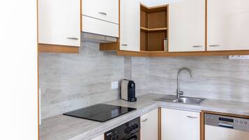 Deluxe Apartment, 2 Bedrooms | Private kitchen | Fridge, microwave, oven, dishwasher