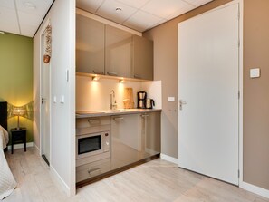 Comfort Apartment, 1 Bedroom | Private kitchen | Fridge, microwave, coffee/tea maker, highchair - Alluring Apartment in Bergen With Terrace, Garden and BBQ (Bergen)