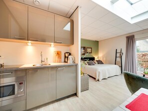 Classic Apartment, 1 Bedroom | Private kitchen | Fridge, microwave, coffee/tea maker, high chair - Alluring Apartment in Bergen With Terrace, Garden and BBQ (Bergen)