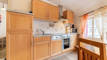 Comfort Apartment, 2 Bedrooms | Private kitchen | Fridge, microwave, oven, dishwasher