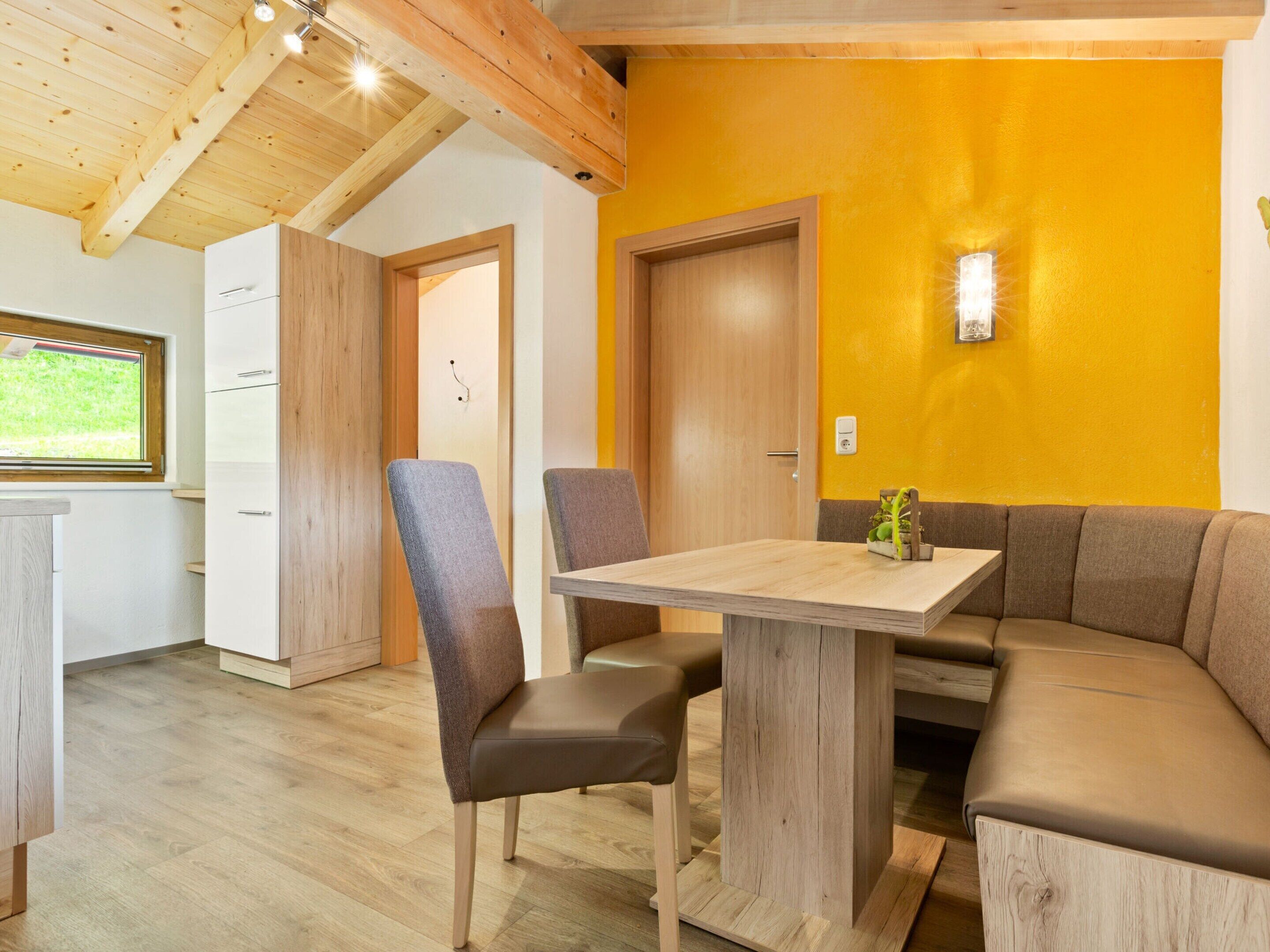 A modern kitchen with wooden cabinets and a built-in oven.