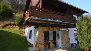 A rustic wooden building with a stone foundation, a wooden deck, and a sign indicating it is a restaurant. - Detached Holiday Residence in the Wonderfully Beautiful Harz (Osterode am Harz)