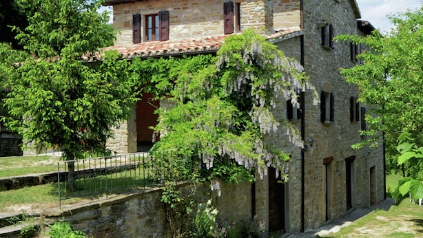 A stone building with a tiled roof, ivy-covered walls, and a small entrance. - Farmhouse in Apecchio With Swimming Pool, Terrace, Garden (Apecchio)