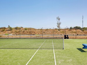 A sports field with a netted goal area, surrounded by a fence and a clear sky. - Holiday Home on a Holiday Park in Ebeltoft (Ebeltoft)