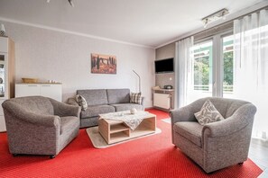 Apartamento conforto, 3 quartos | Sala de estar