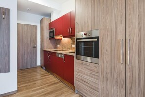 Comfort Apartment, 1 Bedroom | Private kitchen | Fridge, microwave