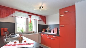 Classic Apartment, 2 Bedrooms | Private kitchen | Coffee/tea maker, fridge, microwave, high chair - Cozy Apartment in Lichtenhain Germany With Garden (Sebnitz)