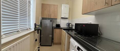 Fridge, microwave, stovetop, coffee/tea maker
