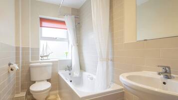 Shower, hair dryer, towels, shampoo