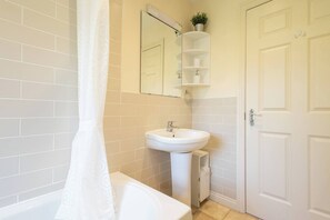 Shower, hair dryer, towels, shampoo