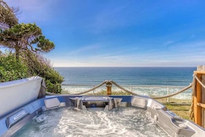 A hot tub with a view of the ocean. - Tranquil Edge Retreat - Truly Oceanfront Hot Tub (Lincoln City)