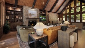 A cozy living room with a fireplace, wooden beams, and large windows. - Iron Tree Lodge Blue Ridge GA (Blue Ridge)