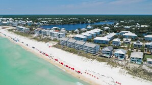 An aerial view of a coastal resort with beachfront villas, a sandy beach, and a clear view of the ocean. - Bike, EV Charger, New Rental! Golf Cart Included, Pool, 30A (Santa Rosa Beach)