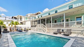 A swimming pool with lounge chairs and a covered deck area. - Bike, EV Charger, New Rental! Golf Cart Included, Pool, 30A (Santa Rosa Beach)