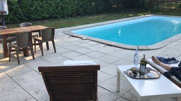 Seasonal outdoor pool, pool umbrellas