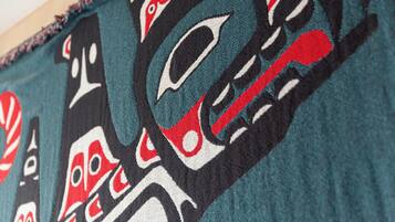 A close-up of a textile with a detailed indigenous pattern.