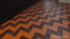 A hotel reception area with a sign reading "UNITY HOTEL," a staircase, and patterned flooring. - Unity Hotel Campinas (Campinas)