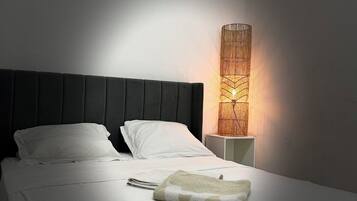 Desk, laptop workspace, blackout drapes, cribs/infant beds