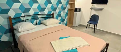 Triple Room | Desk, laptop workspace, blackout drapes, free WiFi