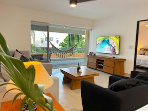 Family Apartment, 2 Bedrooms, Pool View, Poolside | Living area | Fireplace - Relajate hermoso jardín y 2 piscinas (Puerto Aventuras)