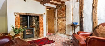 Charming medieval cottage courtyard garden and wood burner in serene Kersey