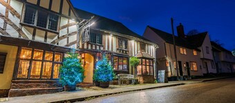 Charming medieval cottage courtyard garden and wood burner in serene Kersey
