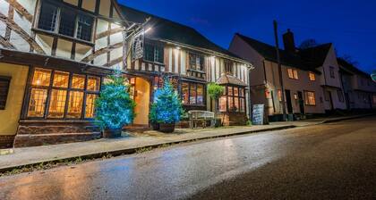 Charming medieval cottage courtyard garden and wood burner in serene Kersey