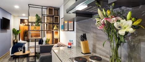 Fridge, microwave, stovetop, coffee/tea maker