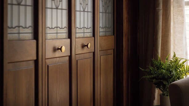 A set of wooden doors with glass panels and brass handles. - The Grape Escape - A-Frame Cabin  (Linden)