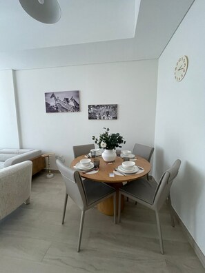 Comfort Apartment, Kitchen, City View | Dining room - Azizi 1 BR Greek Views - 360 vacation (Dubai)