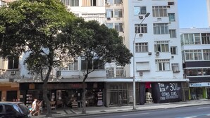 A multi-story building with a modern architectural design, featuring balconies and air conditioning units. - 4 minutes from Copacabana beach | NSC205 (Rio de Janeiro)