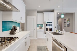 Fridge, microwave, oven, stovetop - Modern home with gas fireplace, mountain views, large yard (Cathedral City)