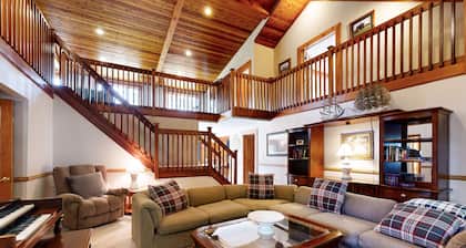 Riverfront mountain view house w/ fireplace, firepit, decks, w/d, wifi, yard