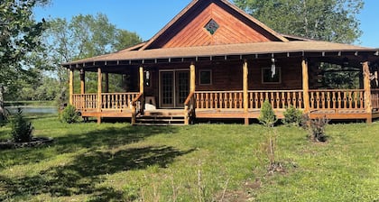 Custom cedar log home in a beautiful setting in the country!!!