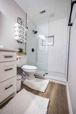 Shower, hair dryer, towels, soap
