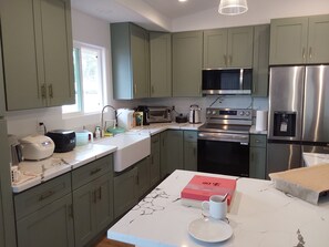 Fridge, microwave, oven, stovetop - Ainaloa Vacation Home of Hawaii! @3-bedroom house in tranquil Pāhoa with WiFi (Pahoa)