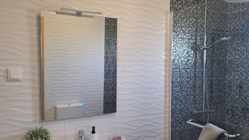 Shower, hair dryer, towels, soap