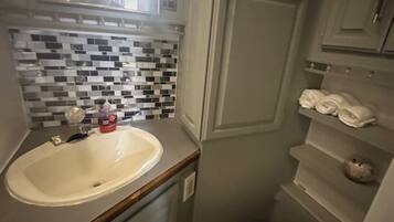 Hair dryer, towels, soap, shampoo
