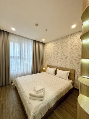 Deluxe Apartment, Balcony, City View | Desk, laptop workspace, blackout drapes, soundproofing - Happy One Central (Ho Chi Minh City)