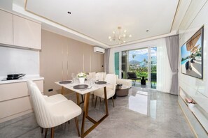 Superior Suite, 1 Bedroom, Balcony, Garden View | Living area | 55-inch Smart TV with digital channels