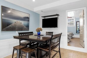 Enjoy meals with a view at the outdoor dining area, easily accessible from the main living spaces. - 3BR Accessible Channel Unit w/ Shared Hot Tub & Waterfront Fire Pit | Walk to Beach (North Myrtle Beach)