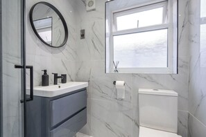Shower, hair dryer, towels, soap