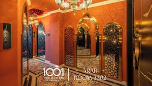 A luxurious hallway with ornate mirrors, a chandelier, and a carpeted floor. - Ngan Le Mot Dem Hotel (Ho Chi Minh City)